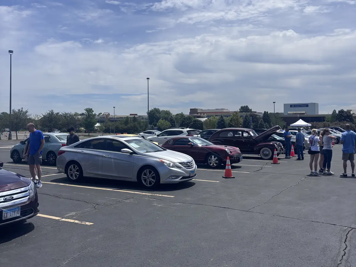 Buyers walking the lot and browsing cars mid-morning at Event #1