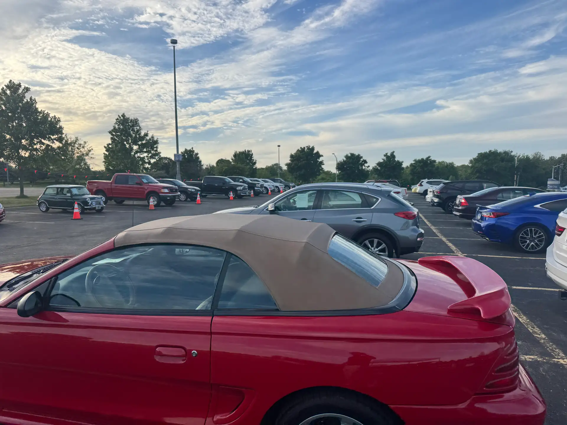 The lot at dawn before doors open, cars lined up and waiting at Event #1